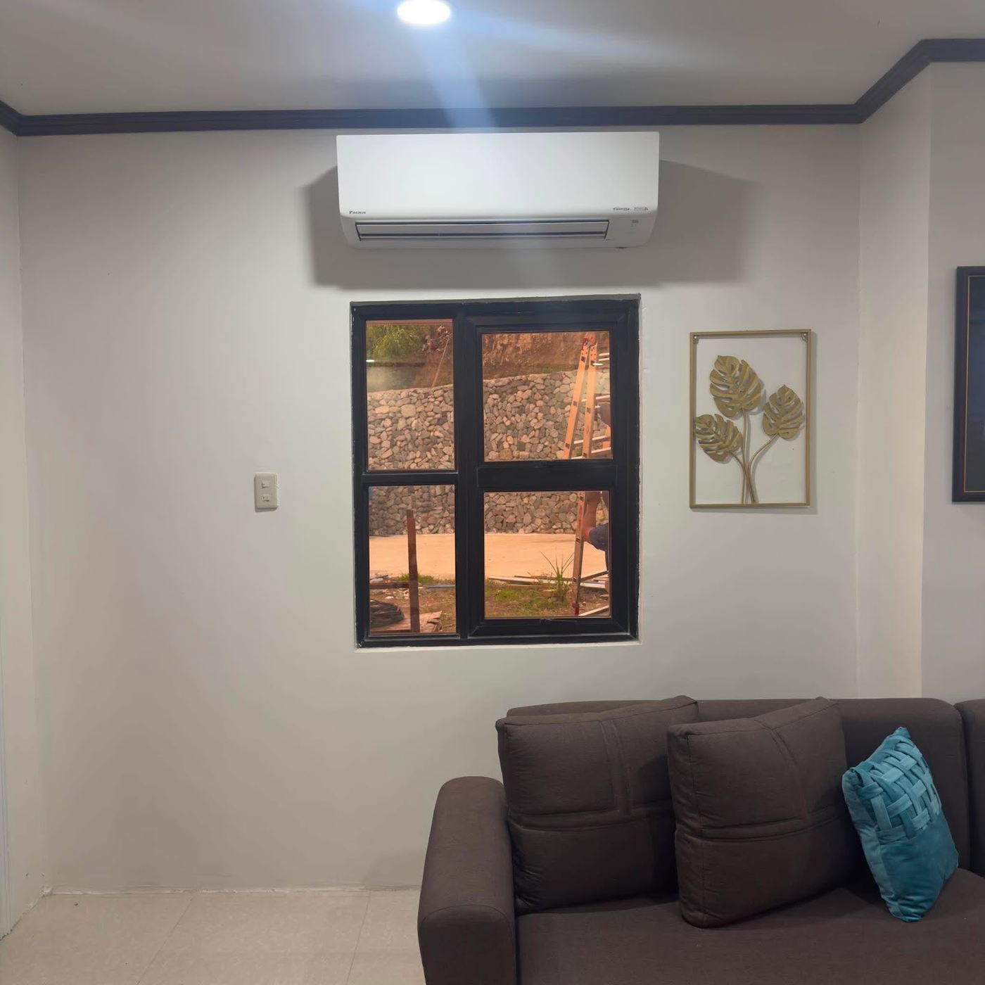 Lounge with a Daikin wall-mounted split above the window